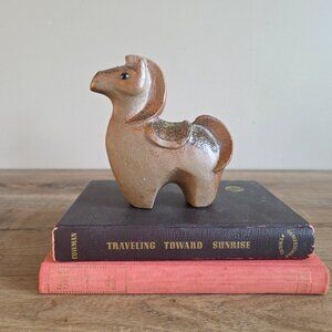 Ceramic horse figurine.
